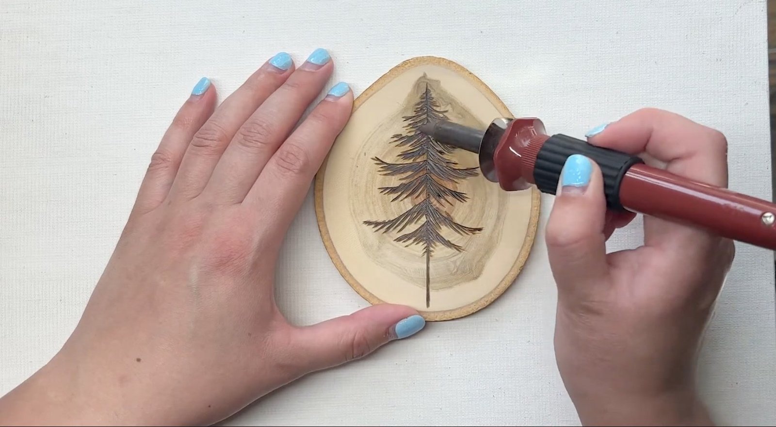 Four pyrography technique examples on basswood: straight lines, curves, shading, and stipple dots