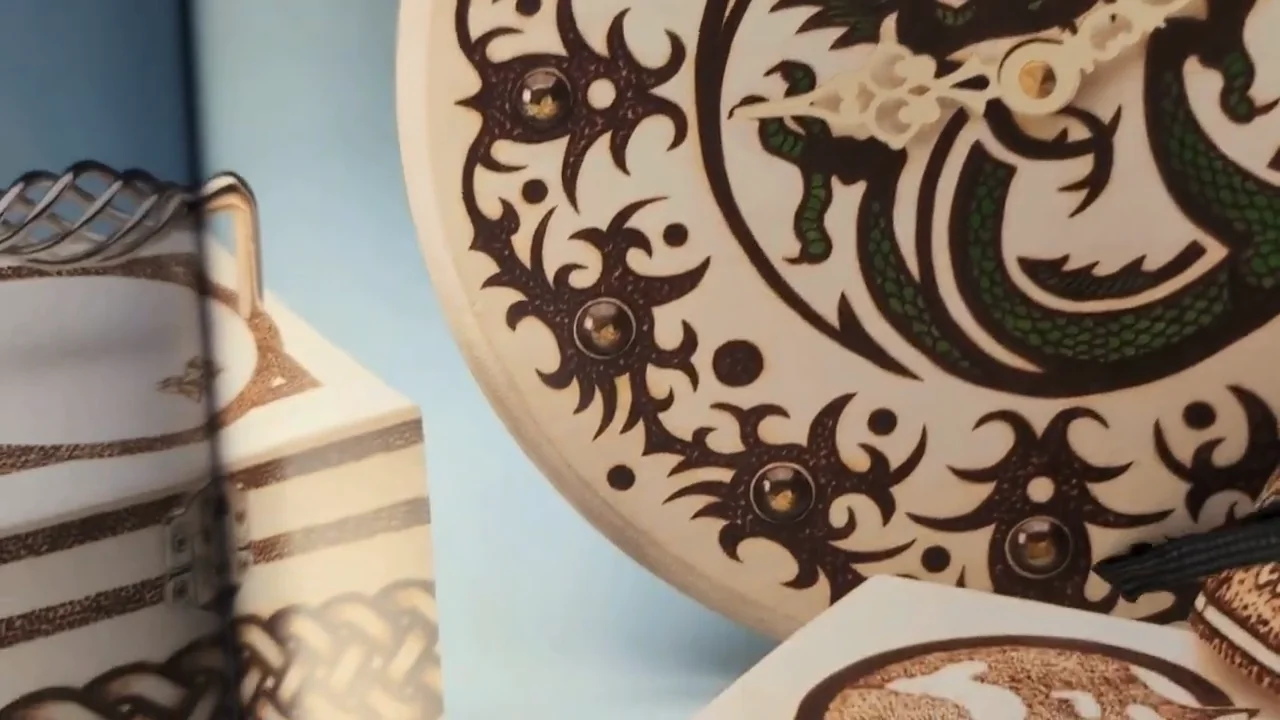 Decorative woodburning on a plate and nearby wooden projects in Learn to Burn