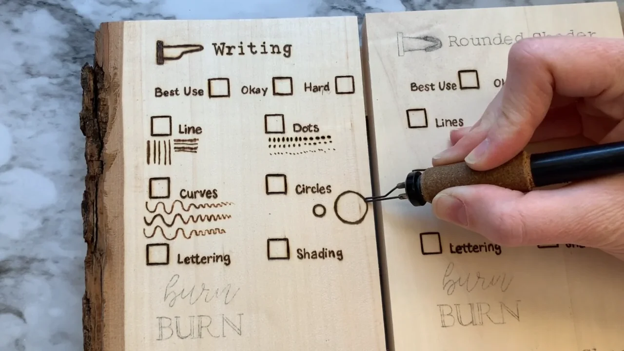 Burning circles on a practice board with samples of lines, curves and dots
