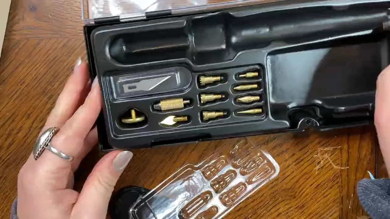 A selection of solid-point woodburning tips arranged in an open tool case